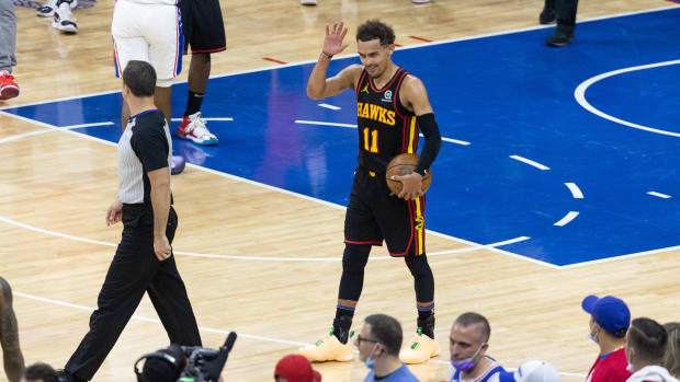 Atlanta Hawks guard Trae Young (11) reacts with fans in the closing seconds of a victory against the Philadelphia 76ers